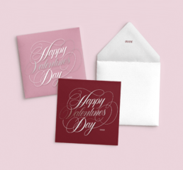 feminine, script, hand-lettering on stationery card that says happy valentines day
