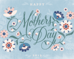 puzzle with script hand-lettering that has graphic flower illustrations growing out of it and says happy mothers day
