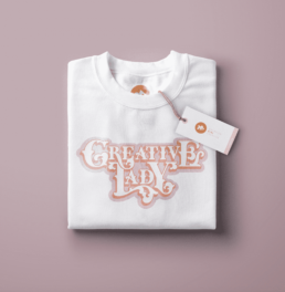 traditional custom lettering that says creative lady, t-shirt design