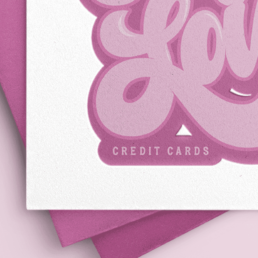 pink, bubble, hand-lettering that says cupid loves credit cards